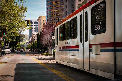 united states tram near buildings during daytime train
